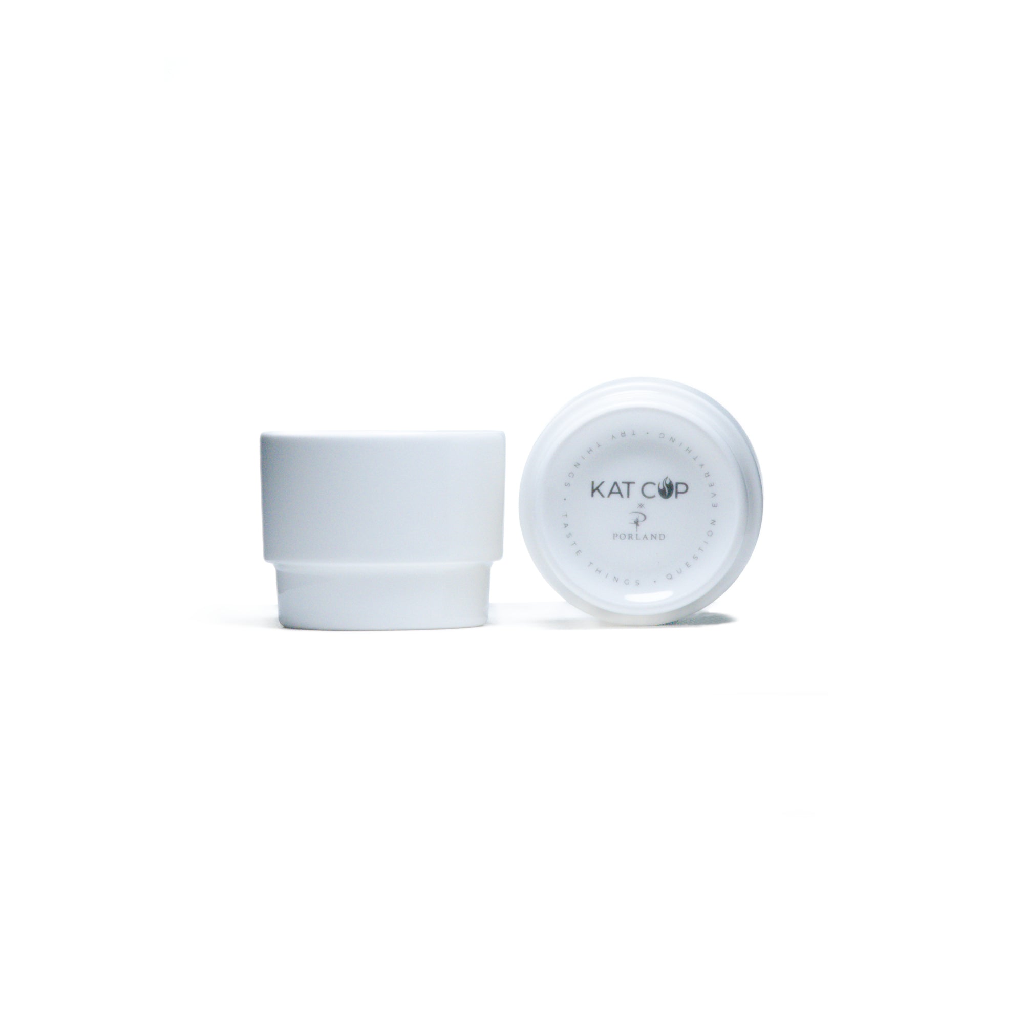 White ceramic cup with lid on a white background